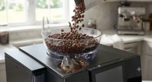 Whole coffee beans falling into the hopper of a super automatic espresso machine featuring an integrated burr grinder.